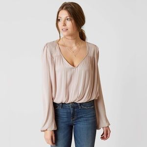Free People Smokin’ N Rockin’ bodysuit in champagne pink size medium